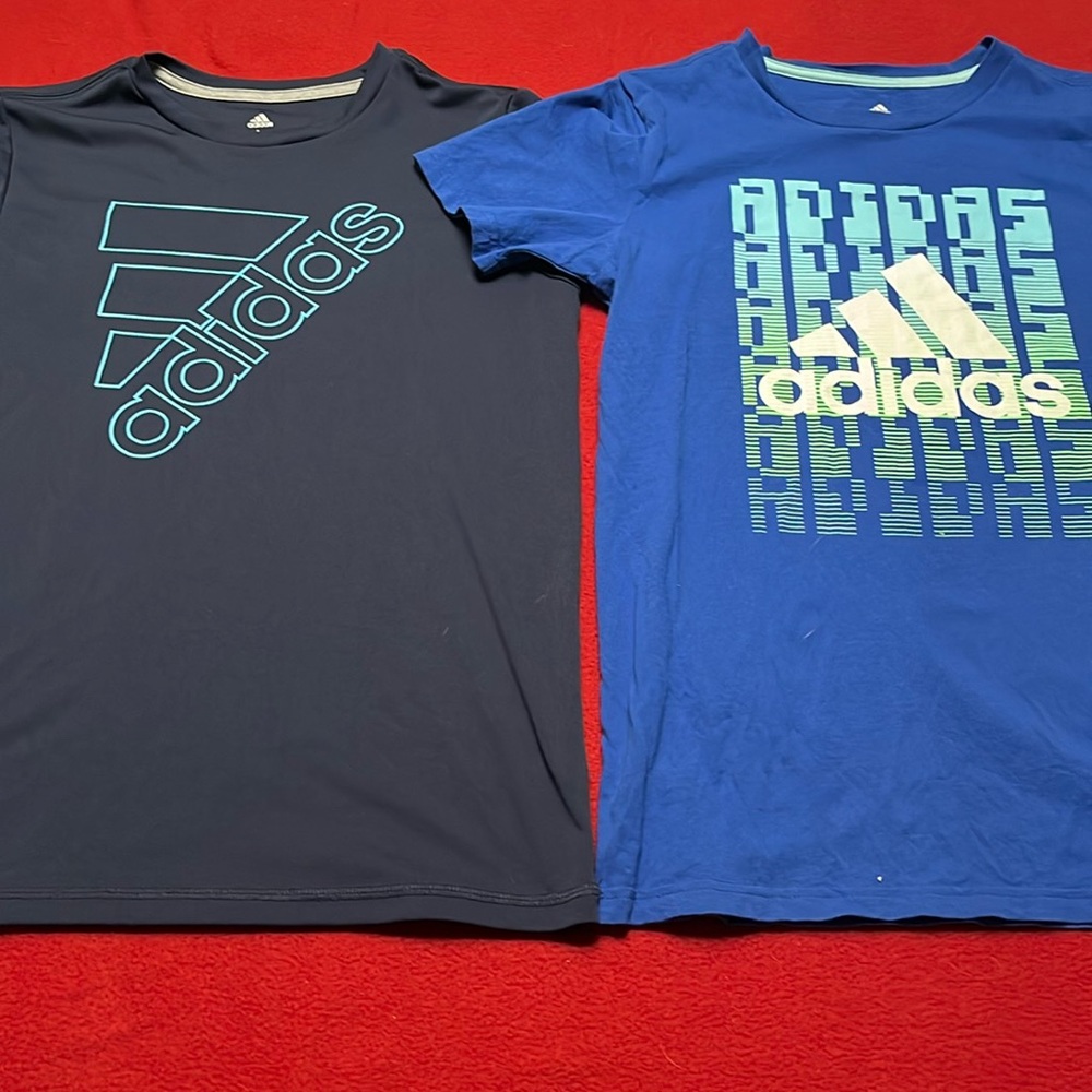 Set of 2 Adidas boys shirts. 14/16 and 18/20 but they are very similar in size.